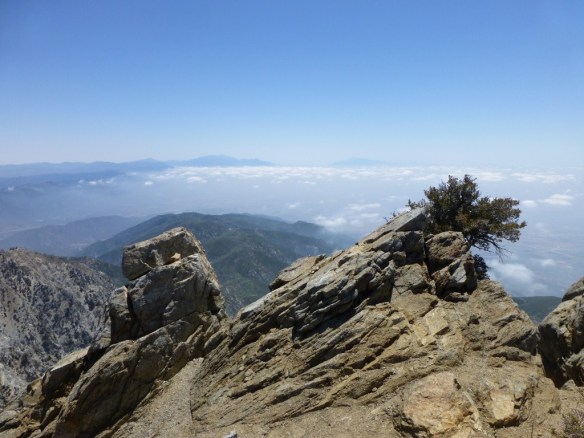 View toward Mt. San Gorgonio and Mt. San Jacinto from Cucamonga Peak with clouds breaking up.
