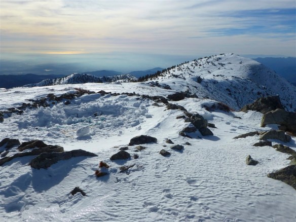 Access to Baldy Notch year round via ski-lift, cutting down the effort required to reach the summit of Mt. Baldy (elevation 10,064') by close to half of the next shortest route is what allows Mt. Baldy to be in this challenge. It is the highest and likely the most popular summit in Angeles National Forest. Just above treeline and extreme in many respects Mt. Baldy is simultaneously challenging and accessible (I've seen young children at the summit--though, not in snow). All routes to Mt. Baldy traverse incredible terrain with stretches that are strenuous. The shortest route from Baldy Notch via the remarkable Devil's Backbone Trail is around 6.4 miles and 2,225' of gain and achievable for most people who like to hike.